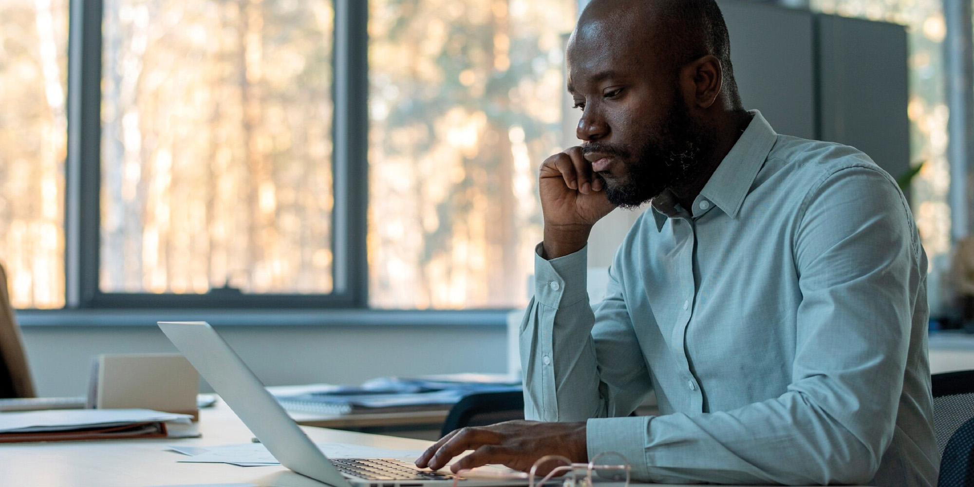 African Business man working on laptop